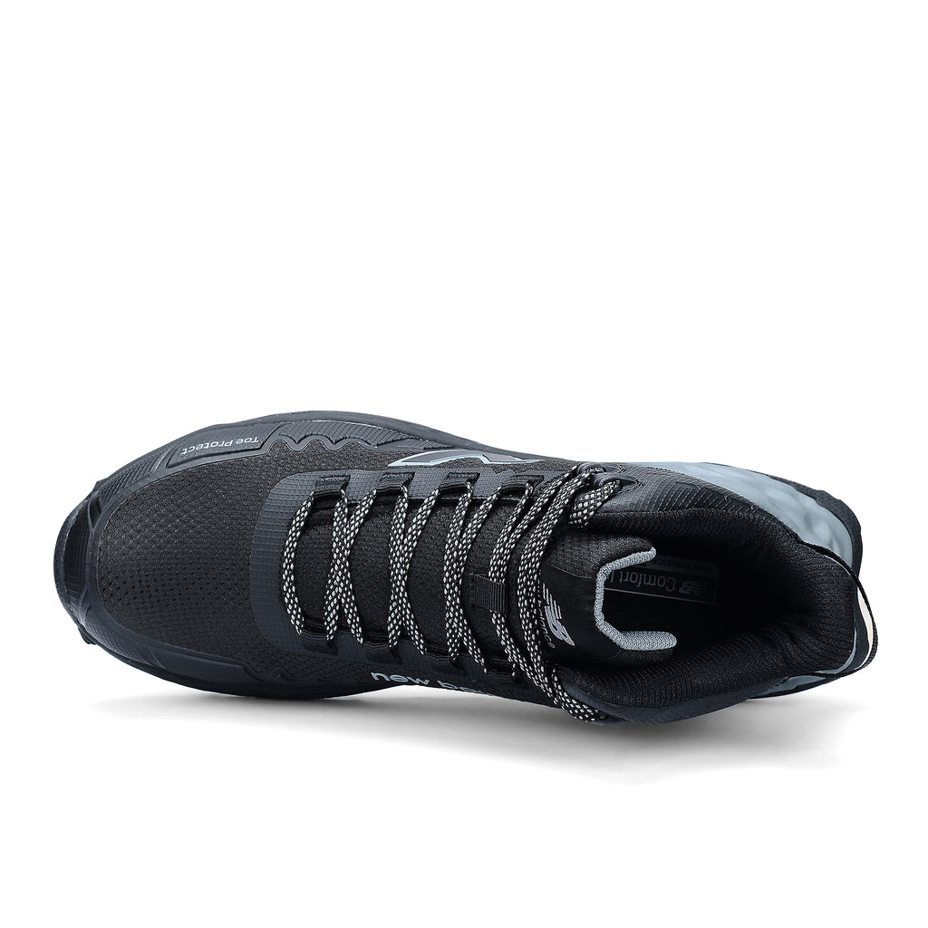 Top view of a black and grey New Balance Men's Cremorne Mid Cut Safety Sneaker (MEFCMCAPBG) with logos on a white background.