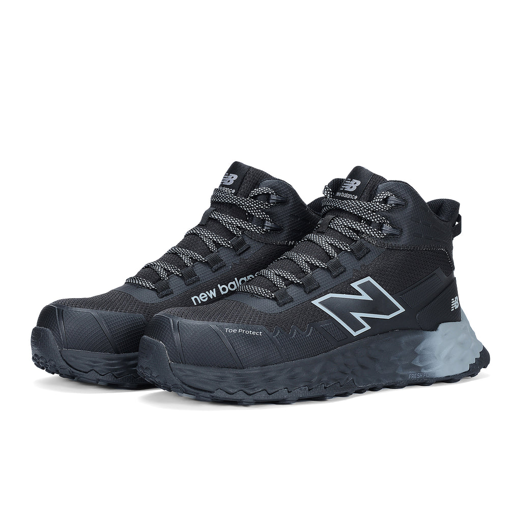 3-4 front view of a pair of black and grey New Balance Men's Cremorne Mid Cut Safety Sneakers (MEFCMCAPBG) with logos on a white background.
