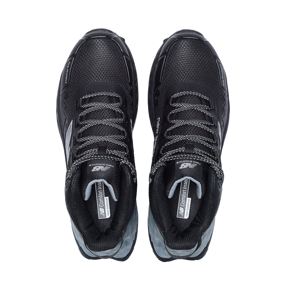Top view of a pair of black and grey New Balance Men's Cremorne Mid Cut Safety Sneakers (MEFCMCAPBG) with logos on a white background.