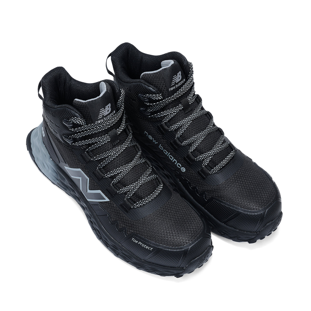 3-4 top view of a pair of black and grey New Balance Men's Cremorne Mid Cut Safety Sneakers (MEFCMCAPBG) with logos on a white background.