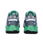 Heel view of a pair of Alloy Green New Balance Men's Cremorne Safety Sneakers (MEFCCAPAG) on a white background.