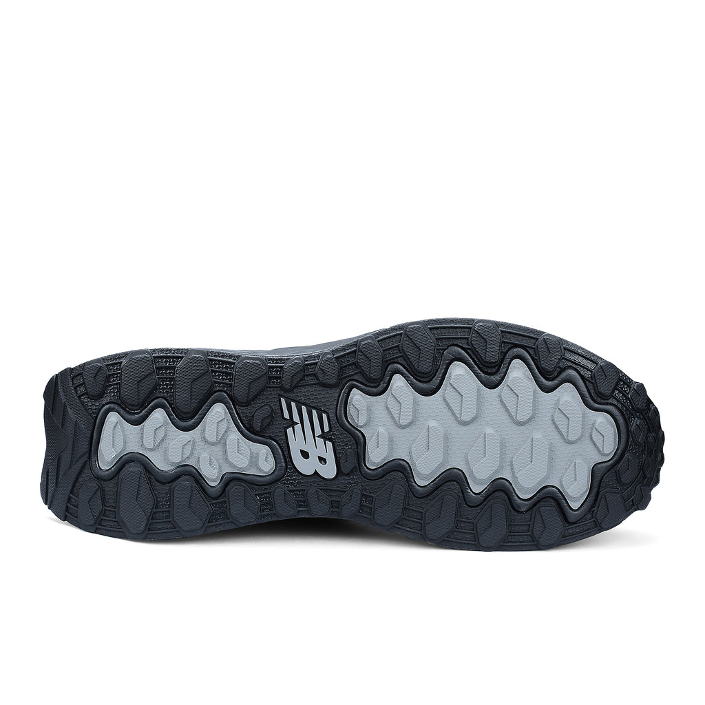 Sole view of a black and grey New Balance Men's Cremorne Safety Sneaker (MEFCCAPBG) on a white background.