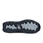 Sole view of a black and grey New Balance Men's Cremorne Safety Sneaker (MEFCCAPBG) on a white background.