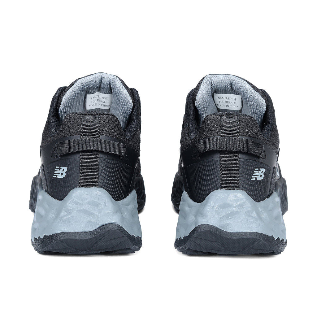 Heel view of a pair of black and grey New Balance Men's Cremorne Safety Sneakers (MEFCCAPBG) on a white background.