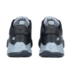 Heel view of a pair of black and grey New Balance Men's Cremorne Safety Sneakers (MEFCCAPBG) on a white background.