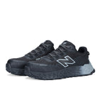 3-4 front view of a pair of black and grey New Balance Men's Cremorne Safety Sneakers (MEFCCAPBG) on a white background.