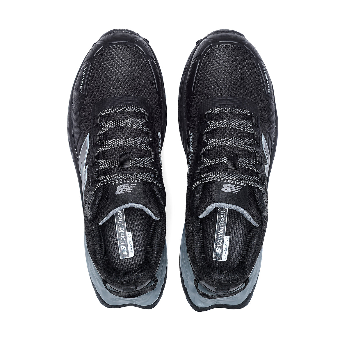 Top view of a pair of black and grey New Balance Men's Cremorne Safety Sneakers (MEFCCAPBG) on a white background.