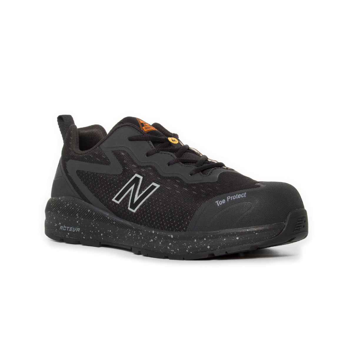 3-4 front view of a black and orange New Balance Men's Logic Composite Toe Sneaker (MIDLOGI) with logo on the side, black laces, and a small orange accent near the tongue, shown against a plain white background.