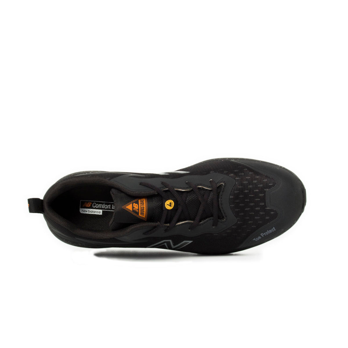 Top view of a black and orange New Balance Men's Logic Composite Toe Sneaker (MIDLOGI) with logo on the side, black laces, and a small orange accent near the tongue, shown against a plain white background.