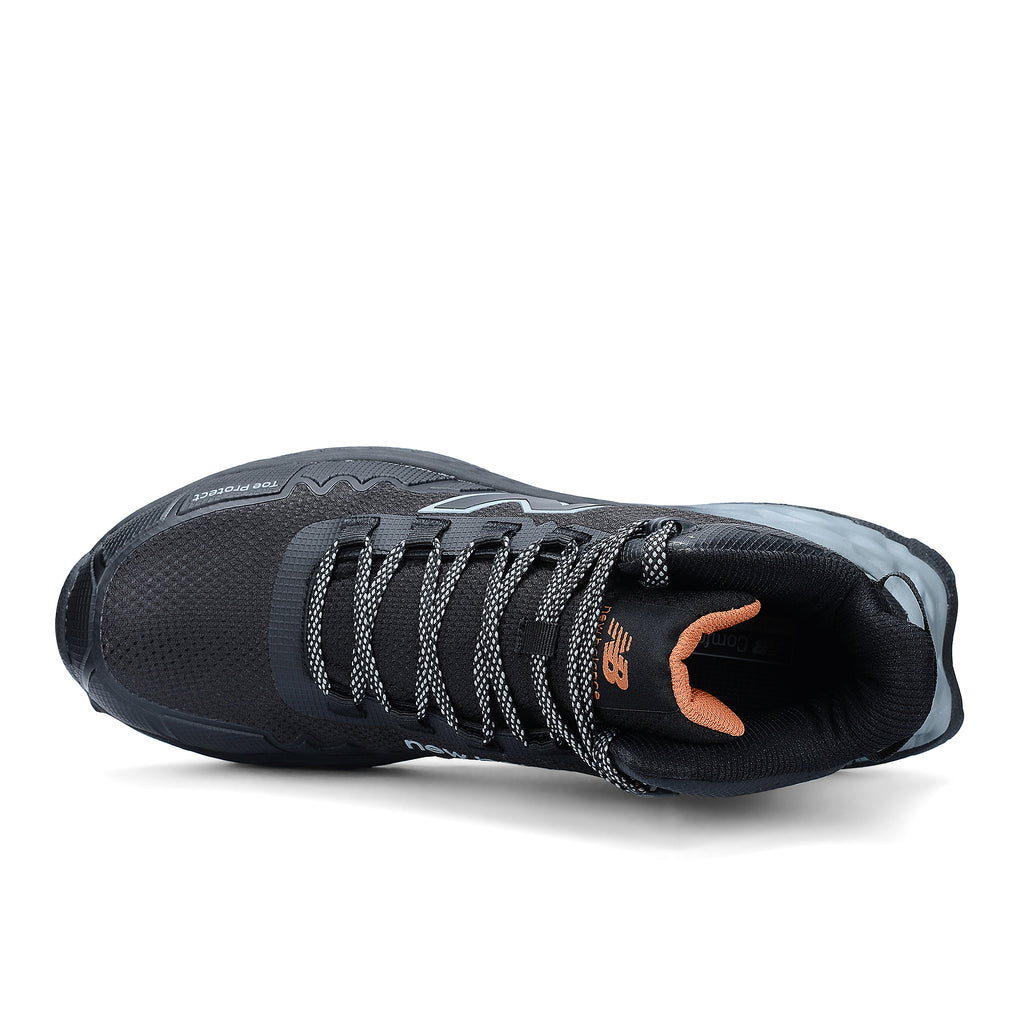 Top view of a black and grey New Balance Women's Cremorne Mid Cut Safety Sneaker (WEFCMCAPBG) with New Balance logos on a white background.
