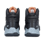 Heel view of a pair of black and grey New Balance Women's Cremorne Mid Cut Safety Sneakers (WEFCMCAPBG) with New Balance logos on a white background.