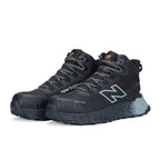 3-4 front view of a pair of black and grey New Balance Women's Cremorne Mid Cut Safety Sneakers (WEFCMCAPBG) with New Balance logos on a white background.
