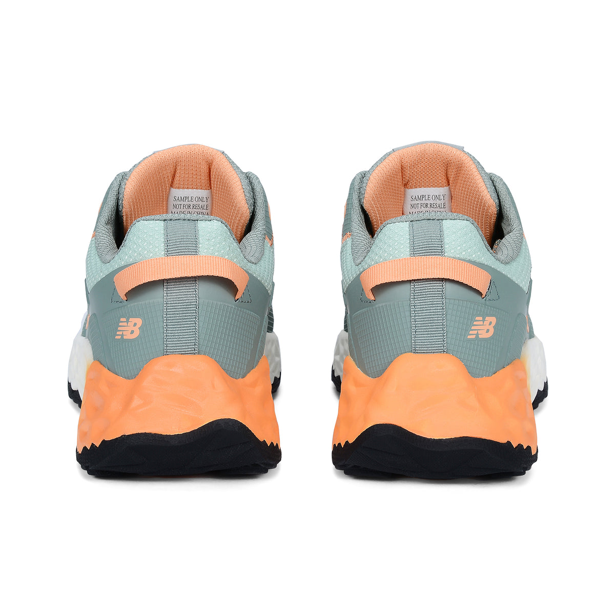 Heel view of a pair of aqua and pumpkin New Balance Women's Cremorne Safety Sneaker (WEFCCAPAP) with New Balance logo on a white background.
