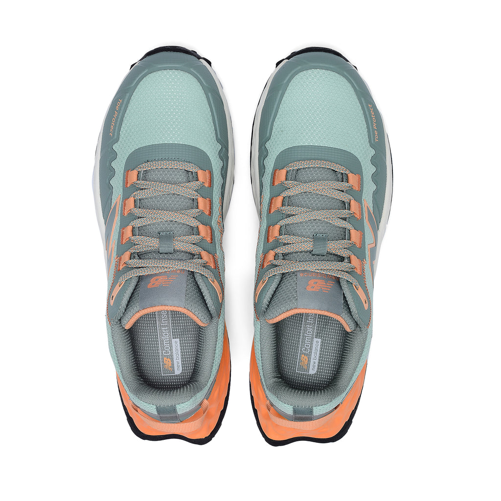 Top view of a pair of aqua and pumpkin New Balance Women's Cremorne Safety Sneaker (WEFCCAPAP) with New Balance logo on a white background.