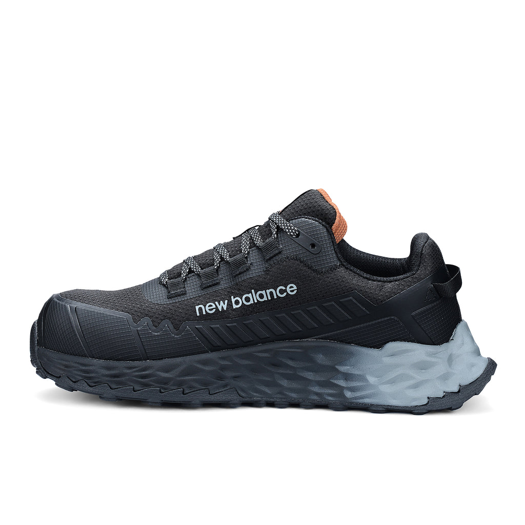 Side view of a black and grey New Balance Women's Cremorne Safety Sneaker (WEFCCAPBG) with New Balance logo on a white background.