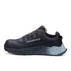 Side view of a black and grey New Balance Women's Cremorne Safety Sneaker (WEFCCAPBG) with New Balance logo on a white background.