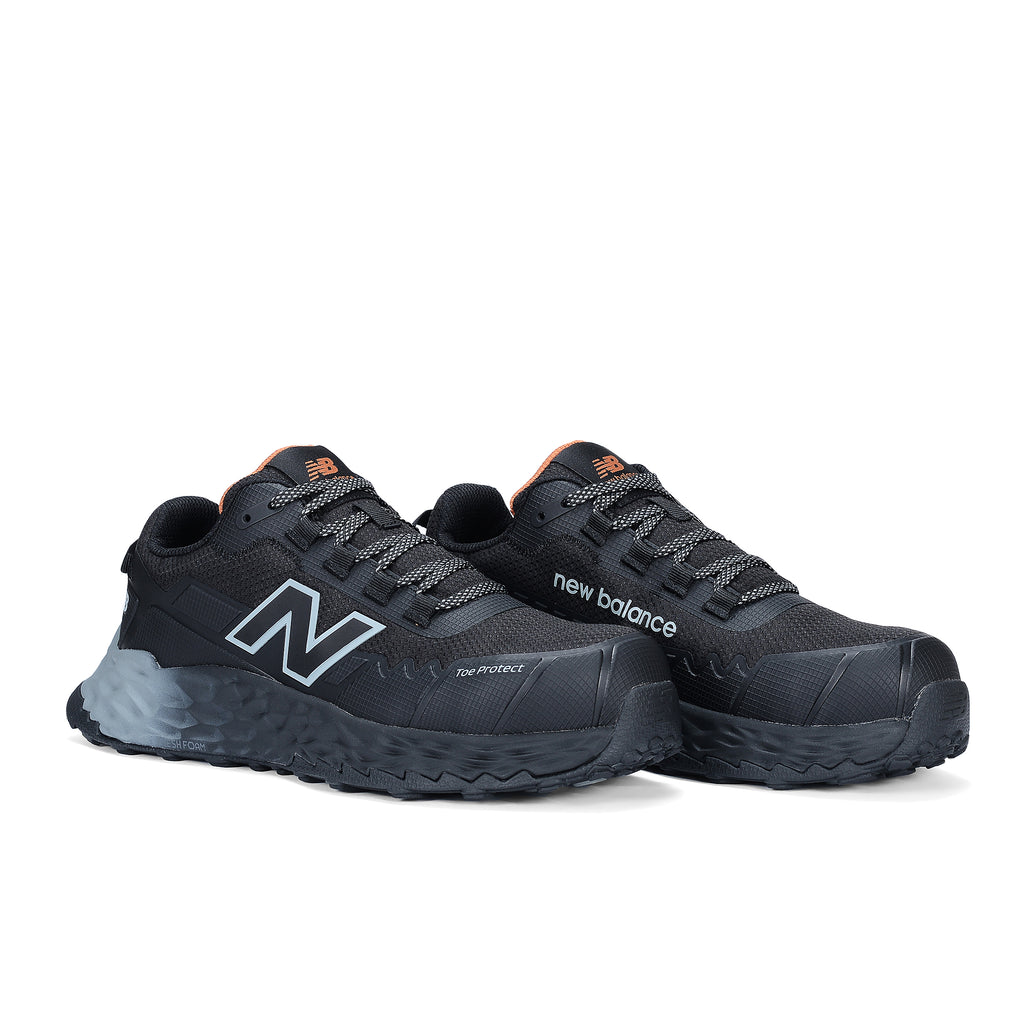3-4 front view of a pair of black and grey New Balance Women's Cremorne Safety Sneaker (WEFCCAPBG) with New Balance logo on a white background.
