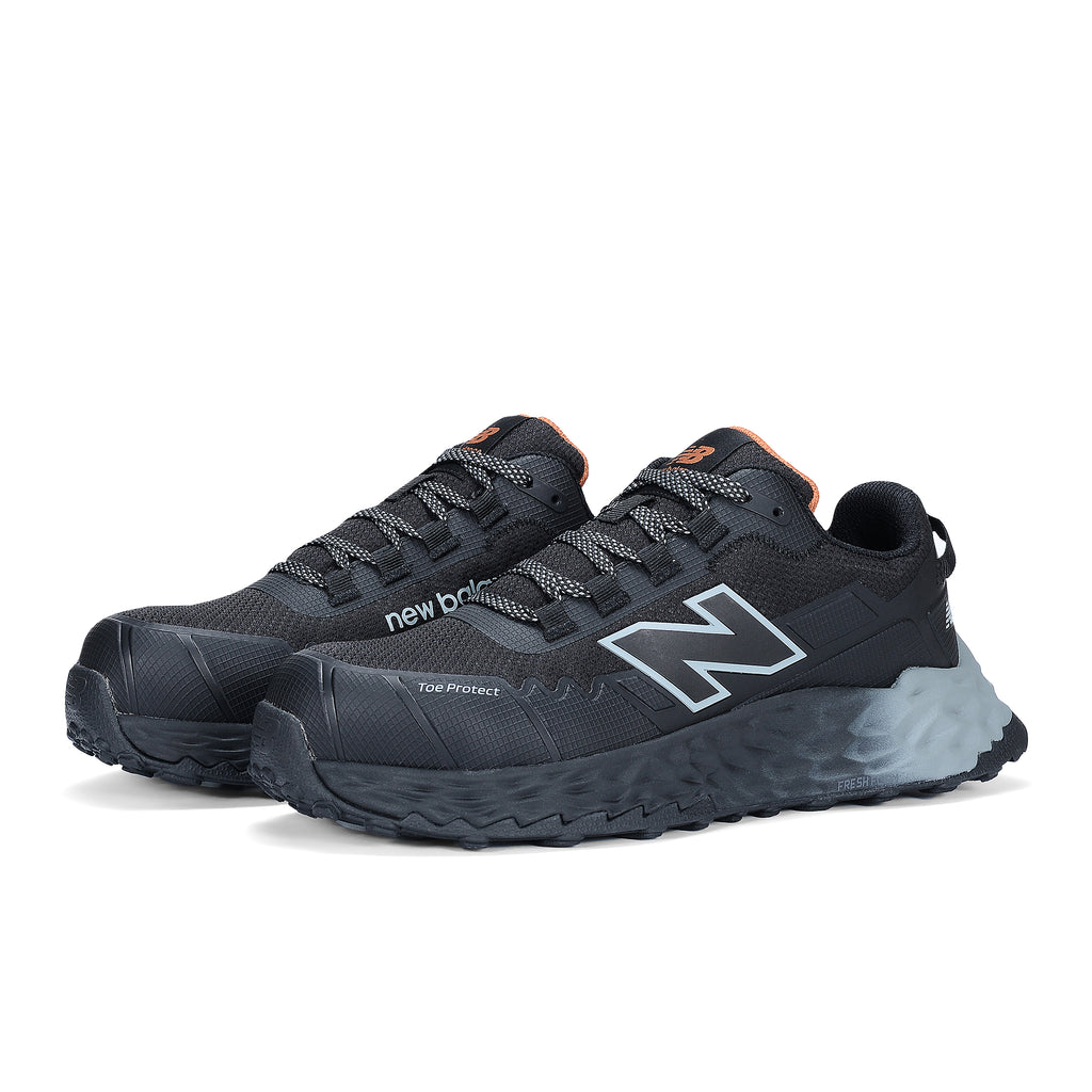 3-4 front view of a pair of black and grey New Balance Women's Cremorne Safety Sneaker (WEFCCAPBG) with New Balance logo on a white background.
