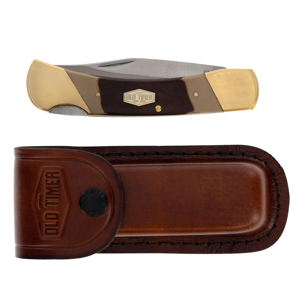 An Old Timer Cave Bear Knife with Leather Pouch (7OT) with a satin finish steel blade, tan and dark brown handle scales, brass bolsters and brass pins, shown above its matching brown leather sheath on a white background.