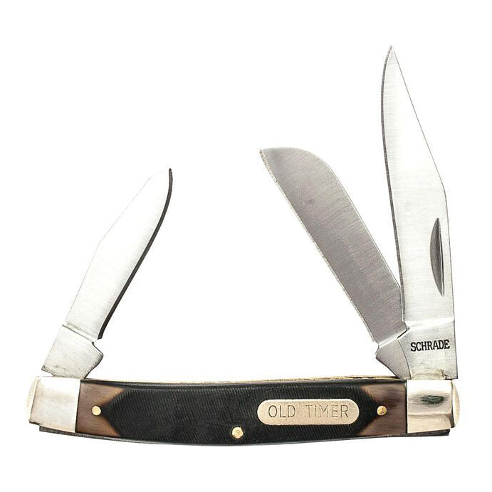 A classic Old Timer 3 Blade Middleman 34OT folding pocket knife with three blades extended, featuring a black and brown handle with a brass 'OLD TIMER' nameplate and SHRADE engraved on the blade.