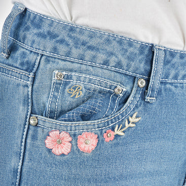 Close up of the front pocket detail of a pair of light blue denim Pure Western High Rise Flora Bootcut Jeans (PCP2213725) against a white background.