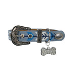 The Pure Western Dogs Kaira Collar (P6W2965CLR) Blue features a light blue strap with blue and white chevron embroidery, metal details, a decorative silver buckle, and a diamanté dog bone tag charm with sparkling rhinestones.