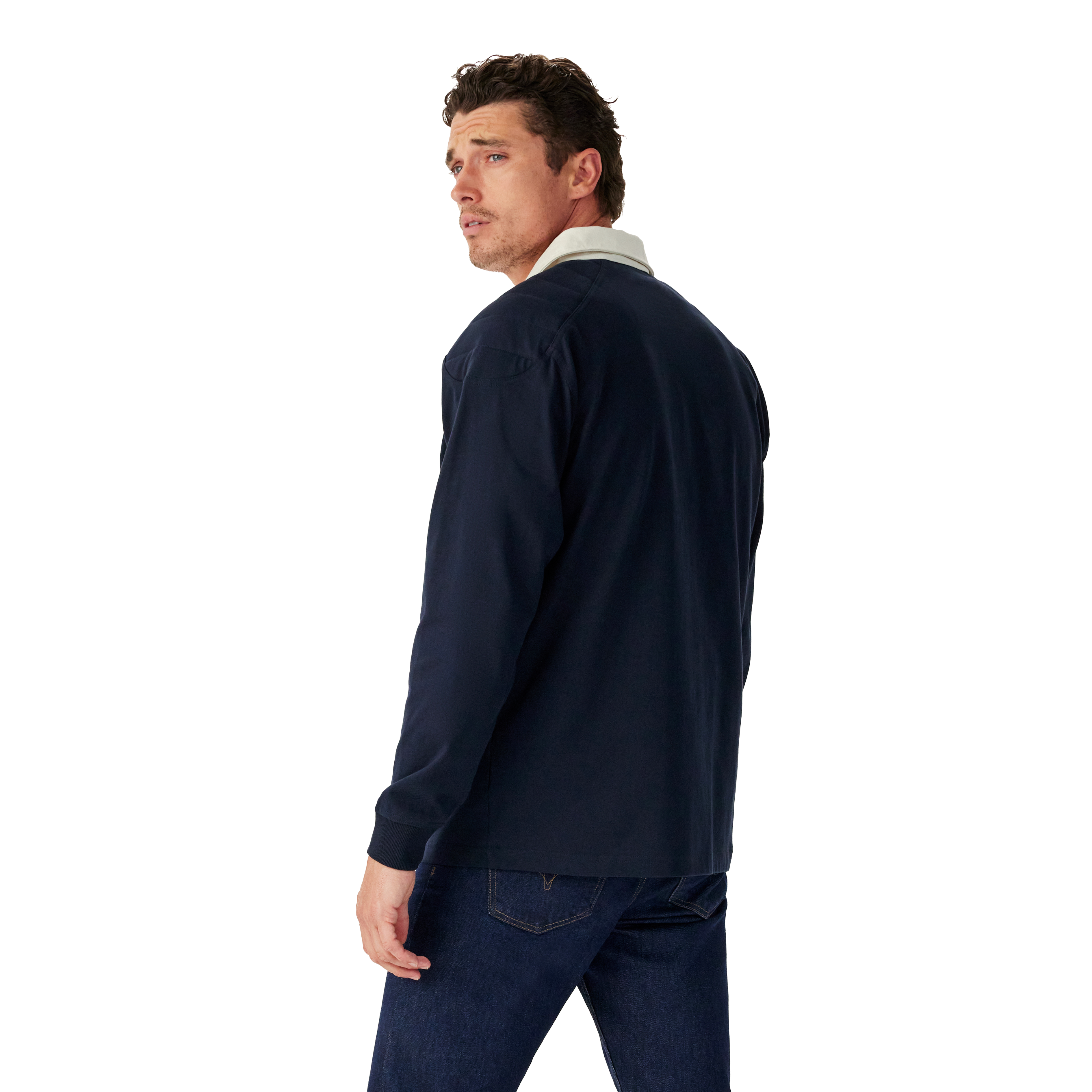 Man wearing a navy R.M.Williams Classic Shoulder Rugby and dark jeans on a white background. R.M.Williams Mens Classic Shoulder Rugby (KR200RJ4502) Navy