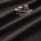 A close up of the fabric of a dark chocolate R.M.Williams Kandos Short Sleeve Tee (KDX10JE06) with the RMW logo that's on the left chest, photographed on a white background.