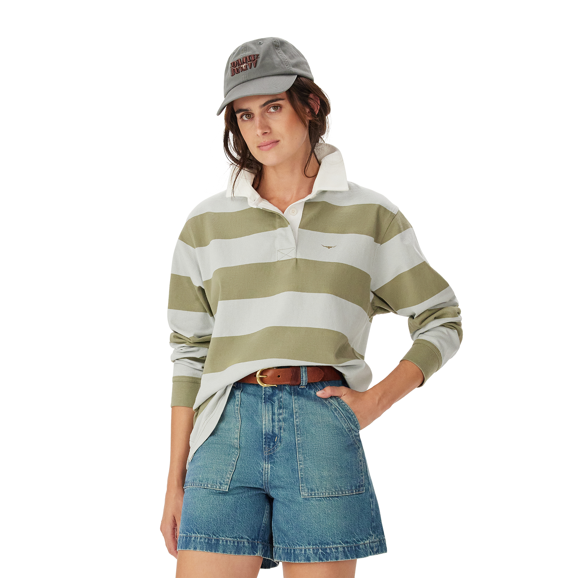 A woman wearing the R.M.Williams Womens Narran Stripe Rugby (KRR00RJ01) in Lichen stands with one hand on her hip against a plain white background.