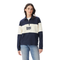 A person wears the R.M.Williams Womens Trickett Panel Sweatshirt (KZR00BB01) in French Navy, featuring navy and white colorblocking with "DRAW REV" text, paired with light blue jeans against a plain white background.