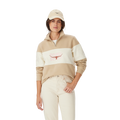 A woman in a beige cap, light jeans, and an R.M.Williams Womens Trickett Panel Sweatshirt (KZR00BB01) Sand stands against a plain white background.