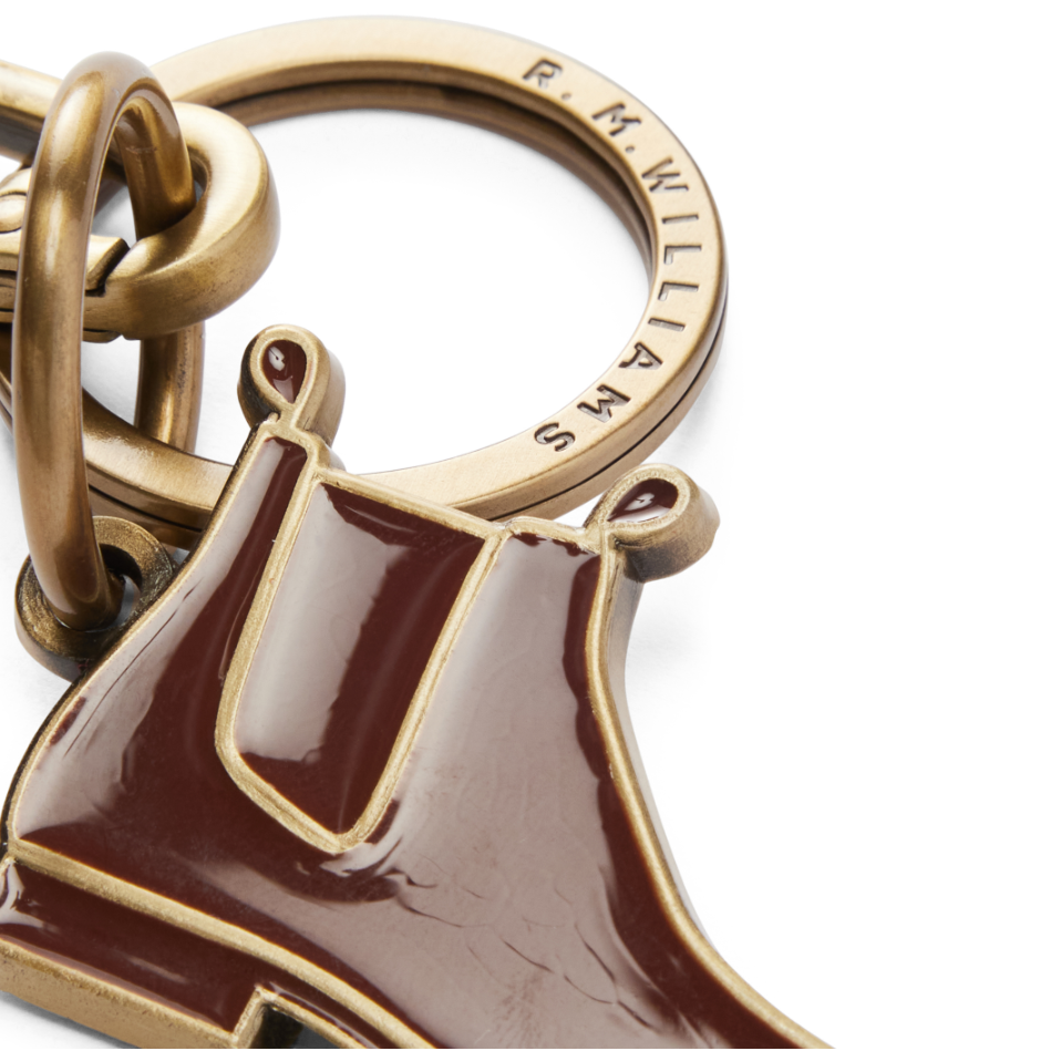Close up detail of an R.M.Williams Men's Boot Enamel Keyring (CKS4AMT01) with boot design on a white background.