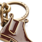 Close up detail of an R.M.Williams Men's Boot Enamel Keyring (CKS4AMT01) with boot design on a white background.