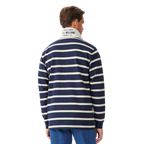 A man viewed from behind wearing a navy and sand R.M.Williams Men's Brunswick Rugby (KR200RJ12) with a white collar on a white background.