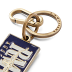 A close up on an R.M.Williams Men's Heritage Logo Enamel Keyring (CKS4AMT02) in blue enamel featuring 'RMW Australia' on a white background