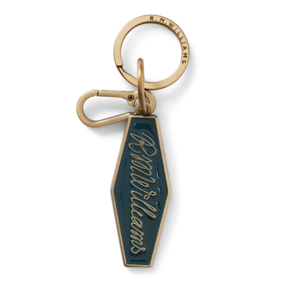 Brass and pine green R.M.Williams Men's Rope Logo Enamel Keyring (CKS4AMT01) with cursive RMWilliams text on a white background.