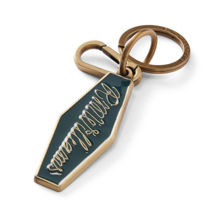 Brass and pine green R.M.Williams Men's Rope Logo Enamel Keyring (CKS4AMT01) with cursive RMWilliams text on a white background.