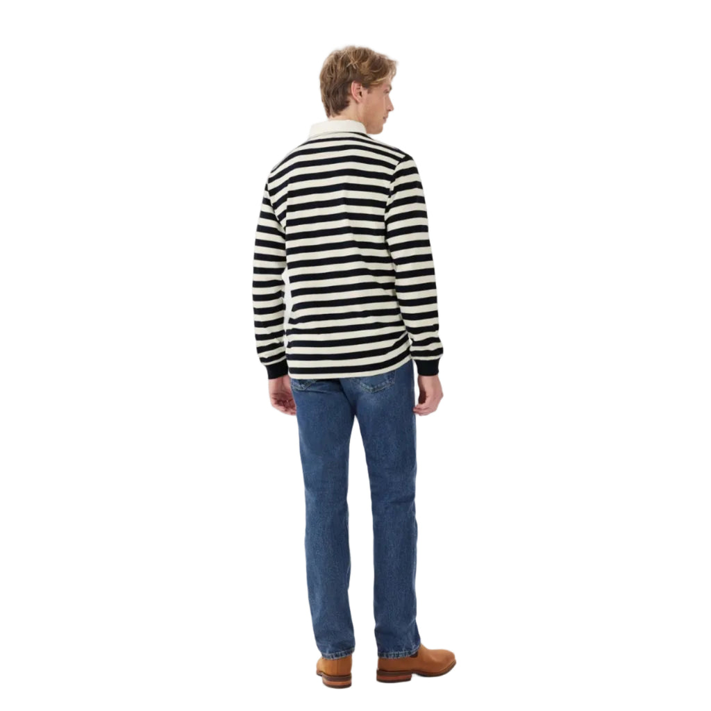 A man viewed from behind wearing a navy and cream R.M.Williams Men's Tweedale Rugby (KR200JS3P01) with a collar on a white background.