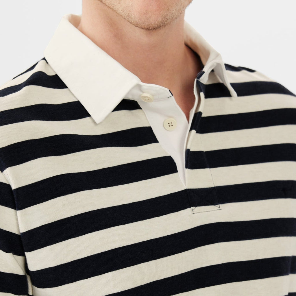 Close up detail of a navy and cream R.M.Williams Men's Tweedale Rugby (KR200JS3P01) with a collar on a white background.