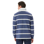 Man viewed from behind wearing a blue and grey marle R.M.Williams Men's Tweedale Rugby (KR200RJ07) and dark jeans on a white background.