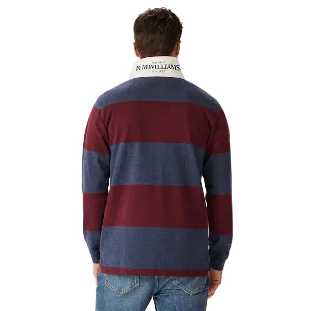 A man viewed from behind wearing a long-sleeve R.M.Williams Men's Tweedale Rugby (KR200RJ07) with red and blue stripes on a white background.