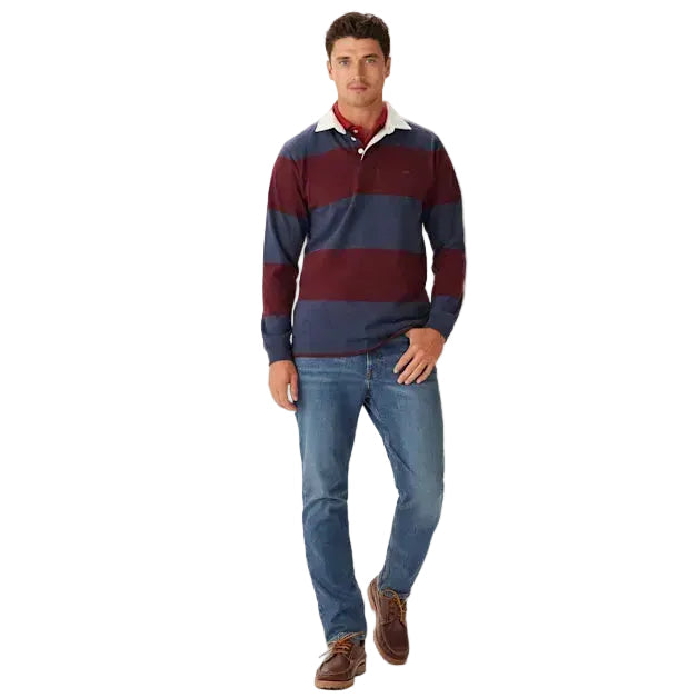 A man wearing a long-sleeve R.M.Williams Men's Tweedale Rugby (KR200RJ07) with red and blue stripes on a white background.