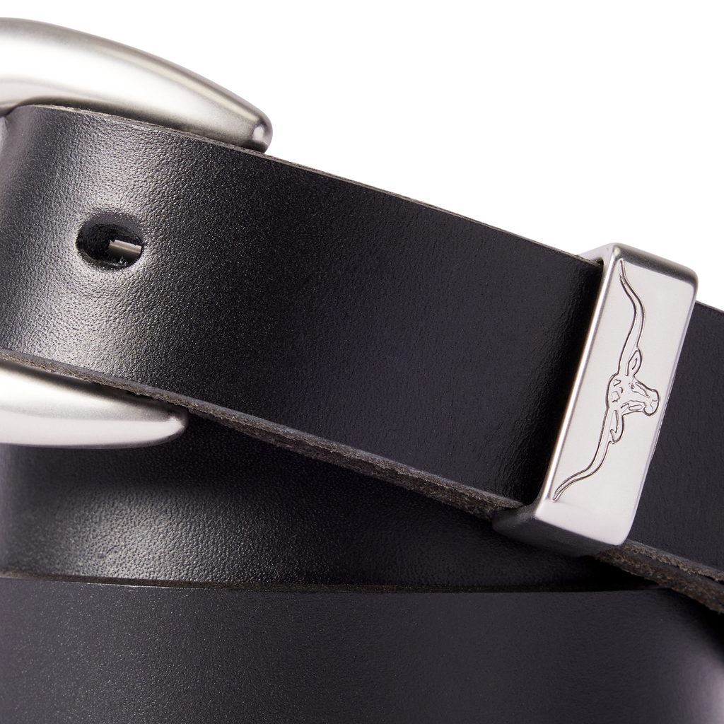 Close up detail of a black R.M.Williams Women's Cate Stitched Belt (BSC5FLE01) with a silver buckle on a white background.