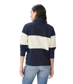 A woman viewed from the back modelling a navy and ivory R.M.Williams Women's Trickett Panel 1/4 Zip Jumper (KZ800RJ01) on a white background.
