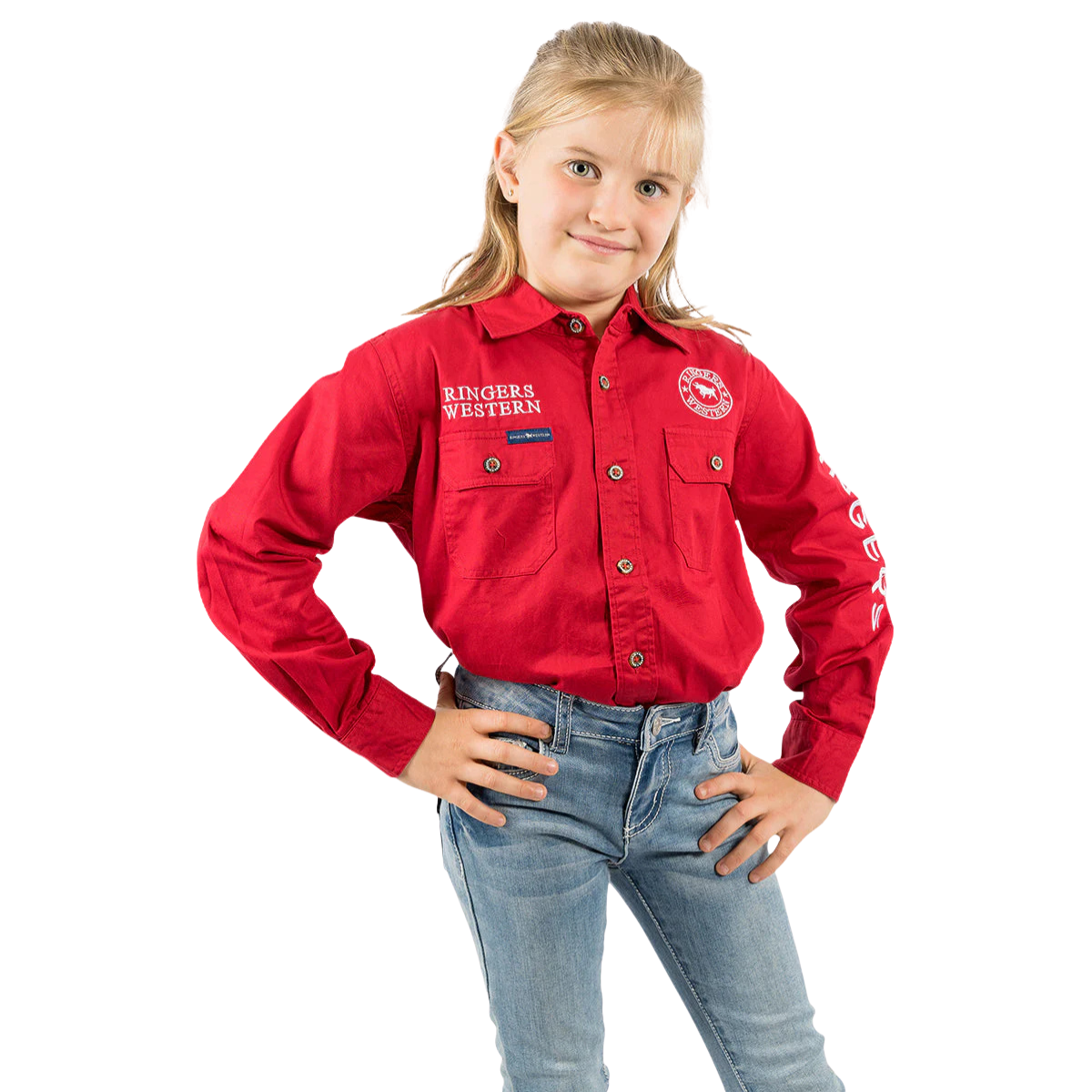 A young girl with blonde hair, wearing a Ringers Western Childrens Jackaroo Full Button L/S Work Shirt in DarkRed with white embroidery and blue jeans, stands hands on hips and smiles confidently at the camera against a white background.