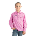 A young girl with light brown hair in a ponytail wears a Ringers Western Childrens Ord River Half Button L/S Work Shirt (171310001) in Pastel Pink and blue jeans, standing against a white background—offering comfort and sun protection.