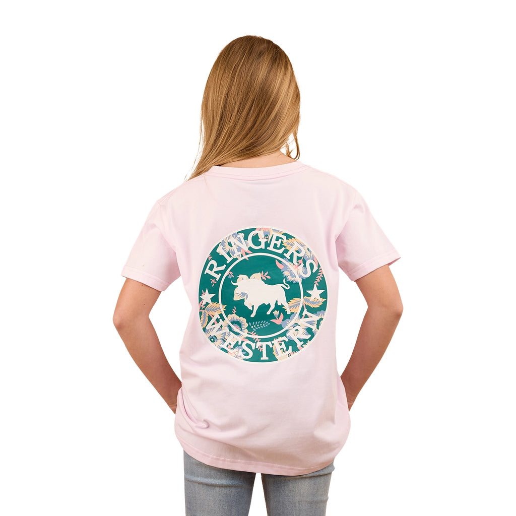 A girl with long blonde hair wears the Ringers Western Childrens Signature Bull Kids Classic S/S Tee in Barely Pink/Floral, featuring a large green and white bull graphic with western designs on the back. She is facing away from the camera.