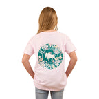 A girl with long blonde hair wears the Ringers Western Childrens Signature Bull Kids Classic S/S Tee in Barely Pink/Floral, featuring a large green and white bull graphic with western designs on the back. She is facing away from the camera.