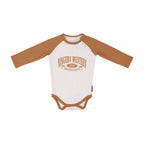 The Ringers Western Infants Western Bub L/S Romper (525010RW) in White/Clay features brown sleeves and trim, a "RINGERS WESTERN 2012 WESTERN WEAR" print, and is made from 100% cotton—ideal for little fans of western style.