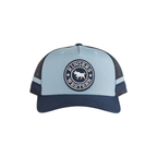 The Ringers Western Mccoy Trucker Cap (425058RW) in blue/navy features a mesh back, circular front logo with bull graphic, two side blue stripes, and snapback closure for classic style and breathable comfort.